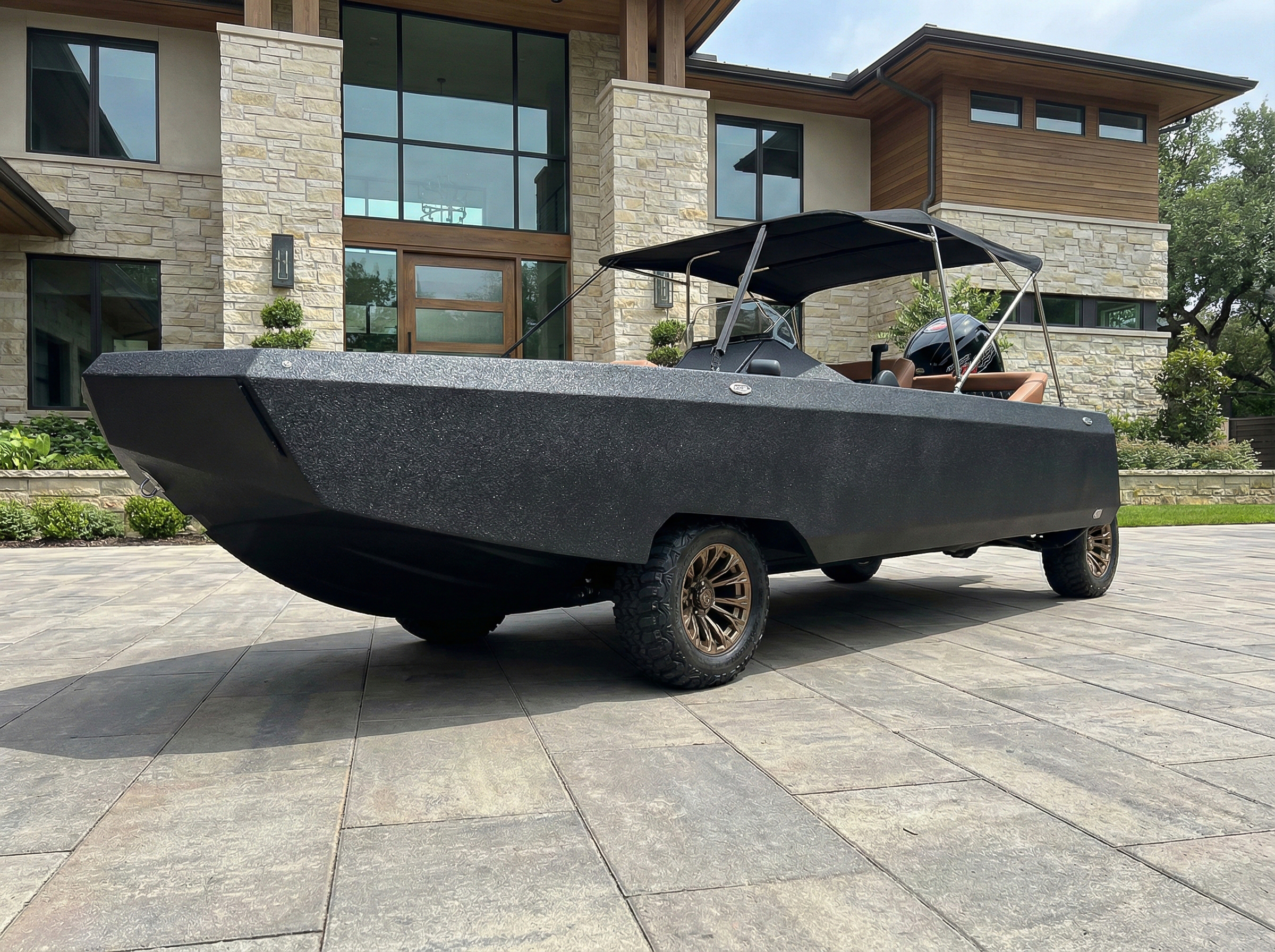 Black Amphibious Vehicle parked outside a hotel