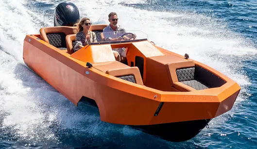 Orange speedboat speeding on blue water with two passengers, wearing sunglasses.